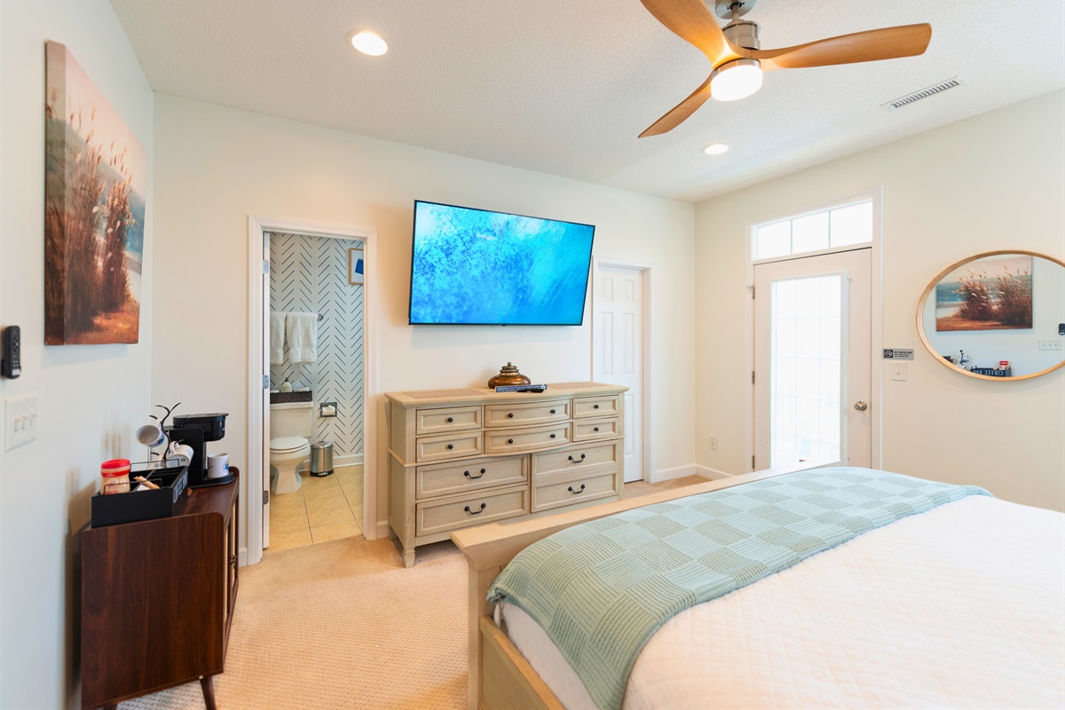 [MasterBedroom] With a large 65" screen smart TV outfitted with a Roku stick, there's enough entertainment to keep you up at night! 