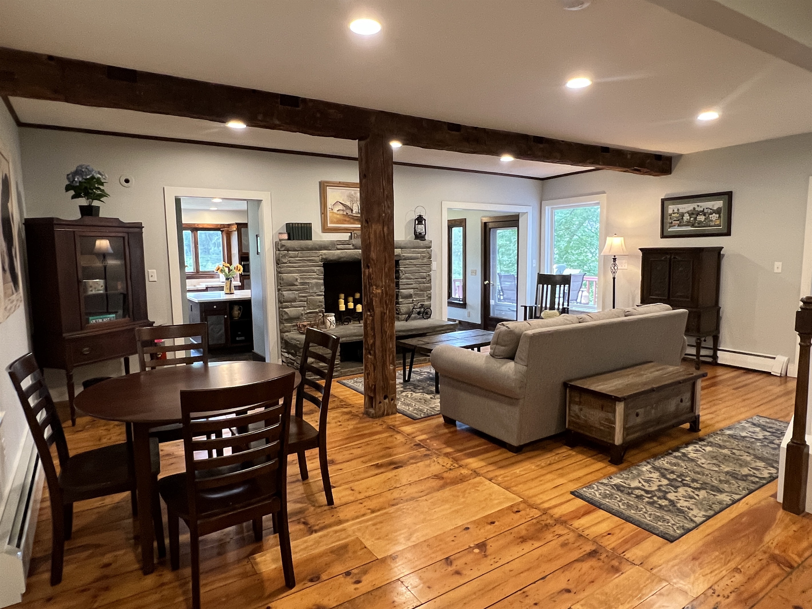 Cloverleaf Farm enjoy the open layout right upon entry! Original farmhouse features still in tact. The hand hewn beams and wide plank floors are just beautiful.