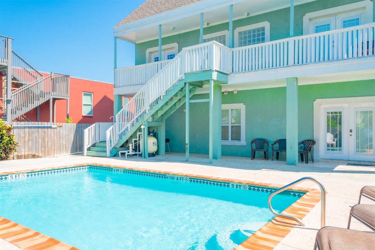 French doors open to the swimming pool area