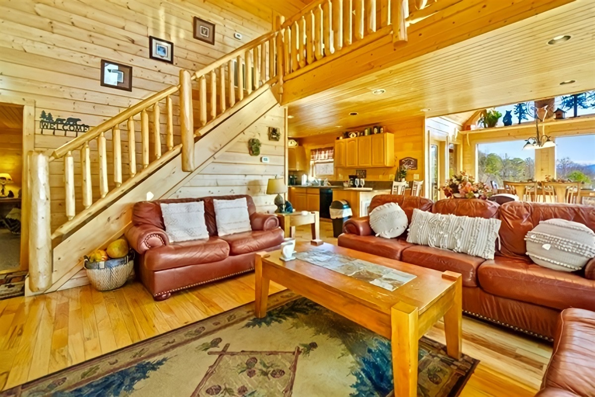 Spacious living room with the master bedroom conveniently located on the first floor, offering easy accessibility and comfort for everyone.