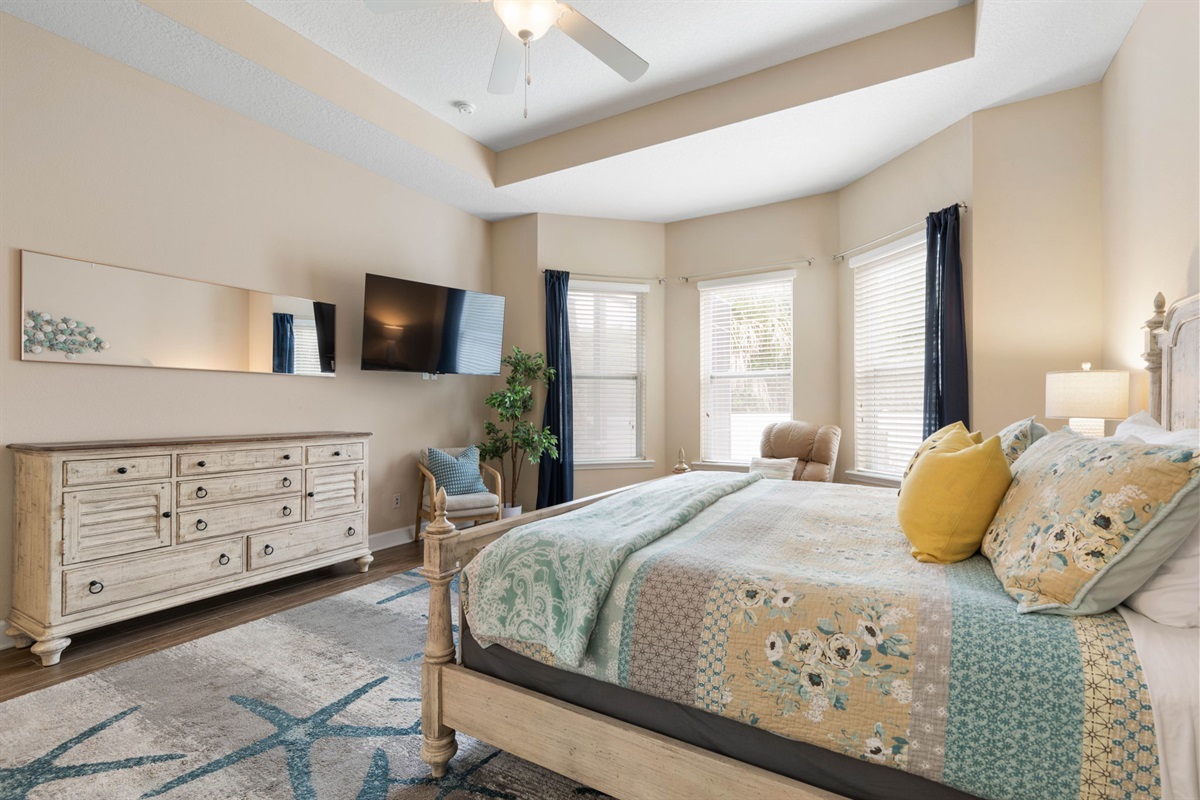 Wake slowly in this serene king suite, stretch out with sunlight filtering through the windows, and end the night with your favorite show and a deep exhale—your own quiet retreat after long beach days and even longer, happier memories.