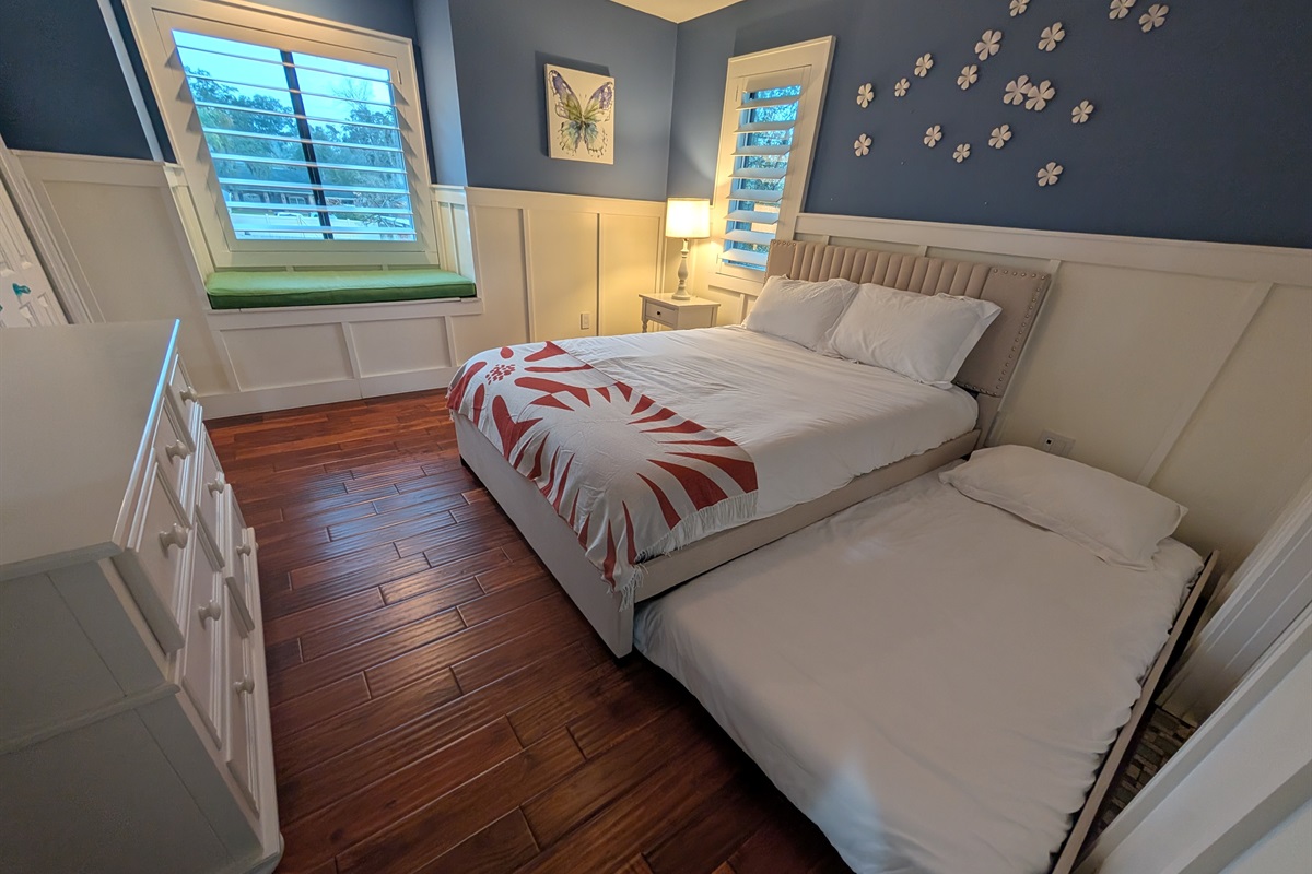 Beautiful upstairs guest bedroom with a queen bed and twin trundle