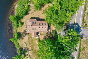 Aerial view from the rooftop with trees surrounding the property