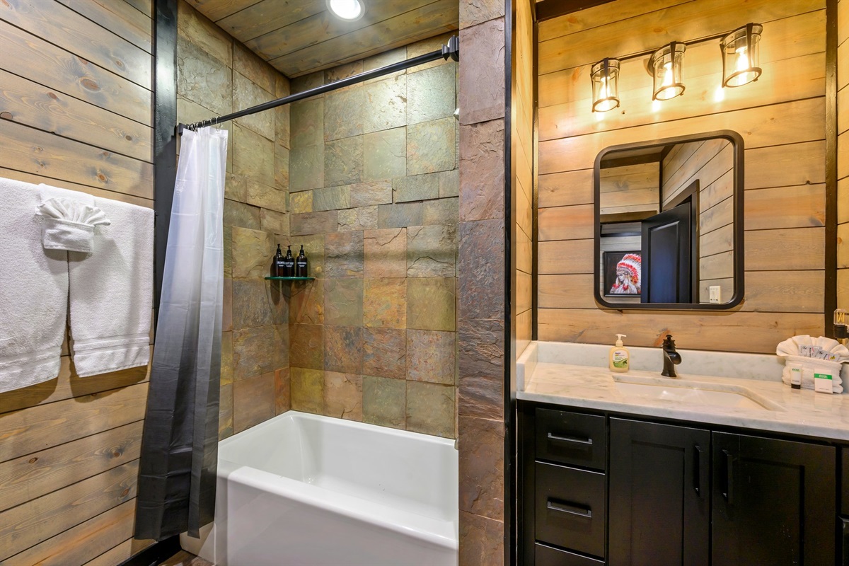 Shower/tub combo in upstairs bedrooms.