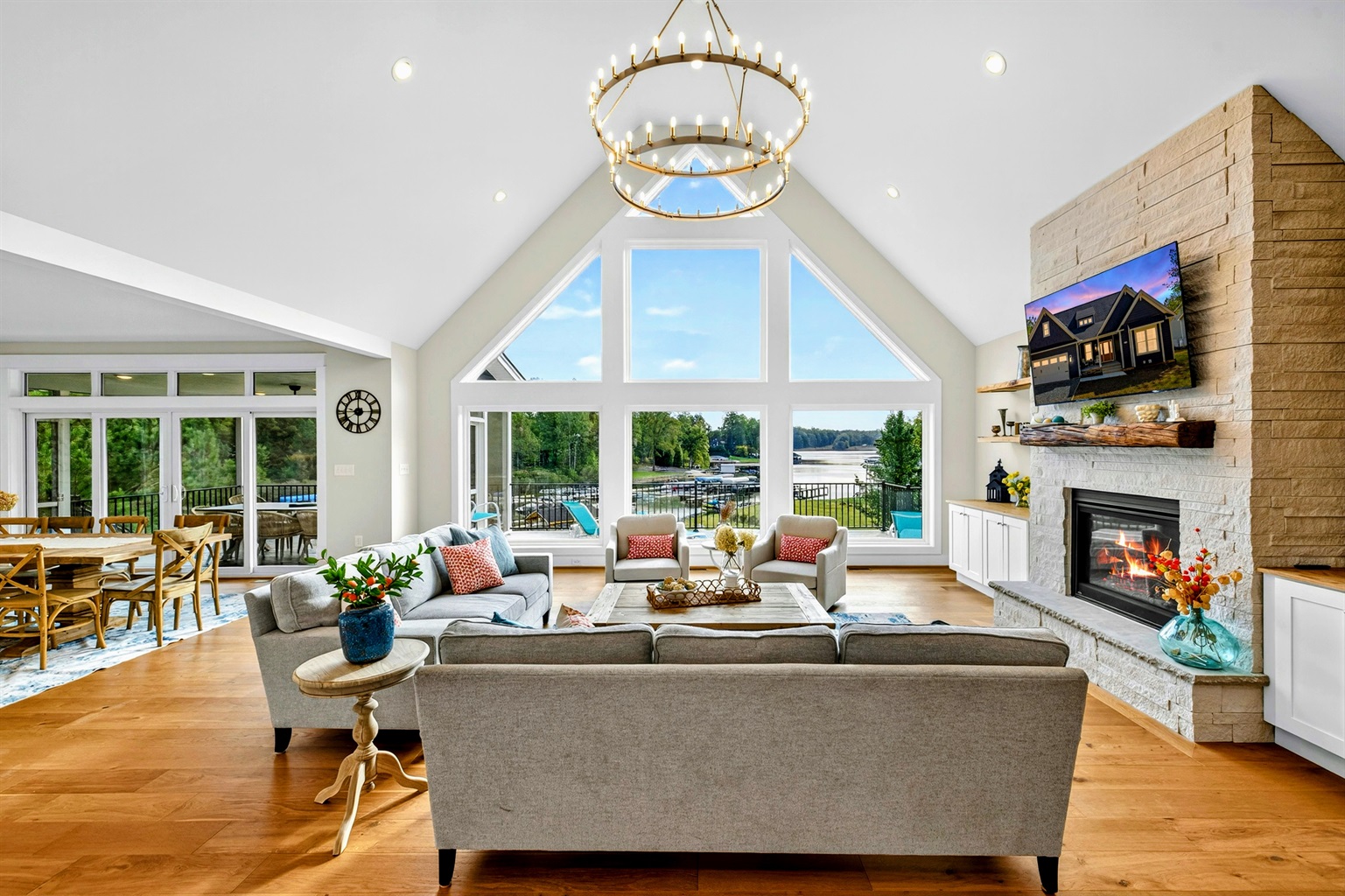 The heart of Blueberry Bay is our great room where an entire two level wall of windows shines panoramic views of the lake and floods this South facing house with natural light all day! The sunrises are stunning also and not to be missed-our favorite!