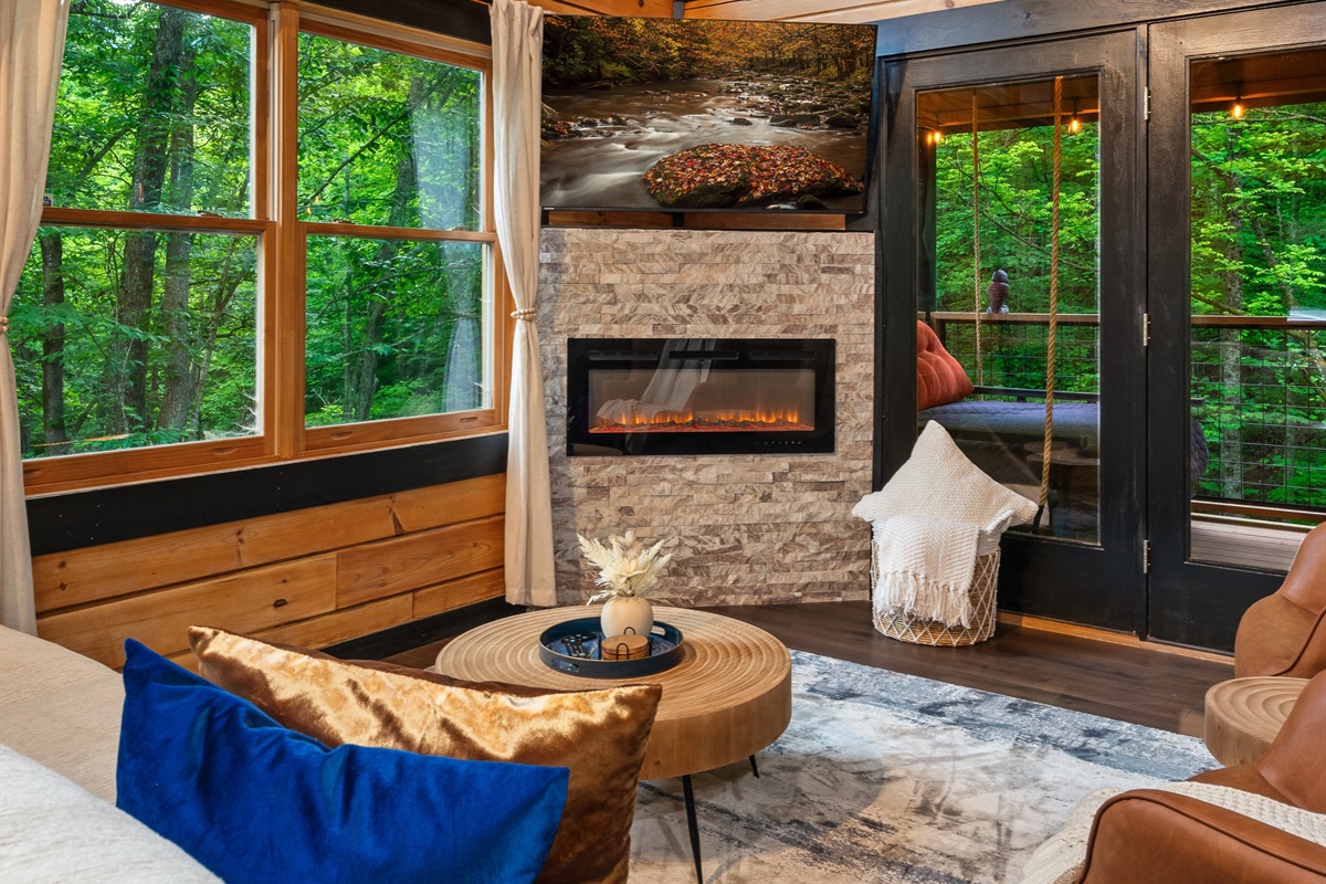 Cozy Fireplace and Large Windows allowing abundant Light