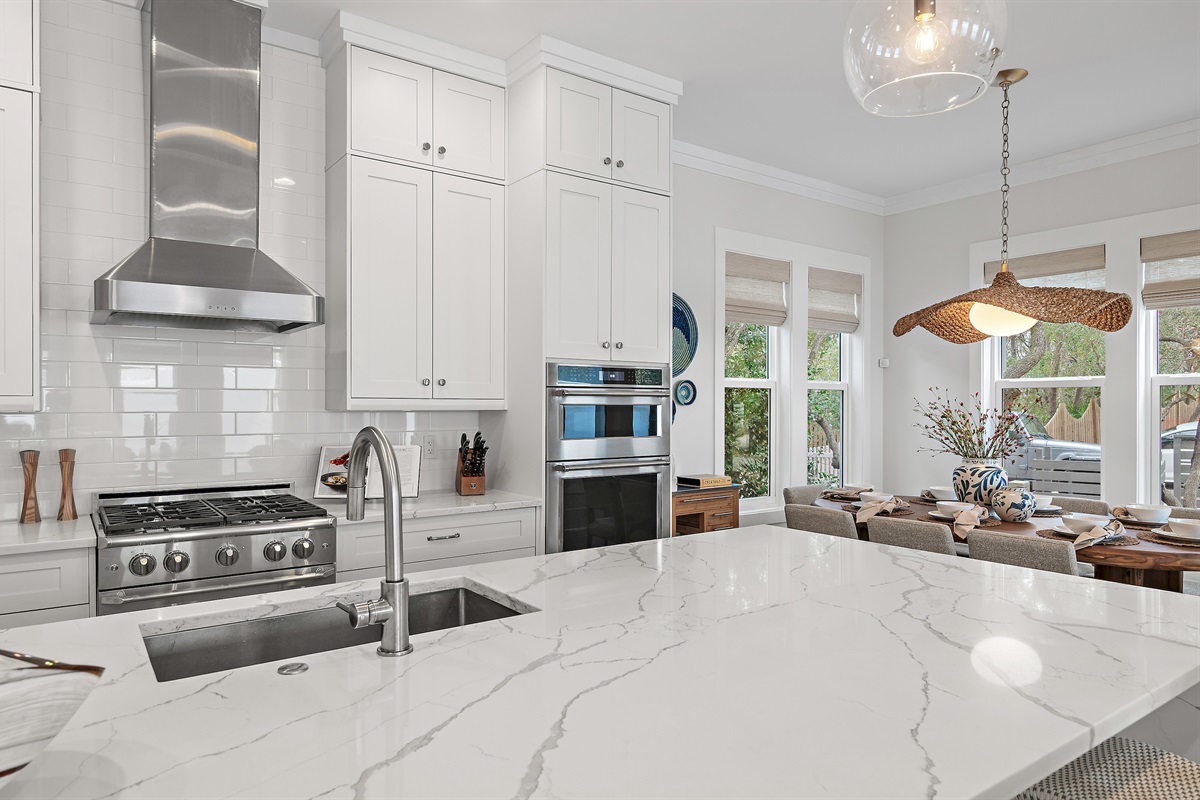 Chef's kitchen is fully stocked with pots, pans, baking dishes, and all of the cooking utensils you might need to prepare meals.