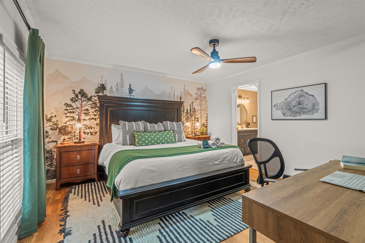 🌲 Rest and recharge in the serene master suite, featuring a king bed and lush forest-inspired decor