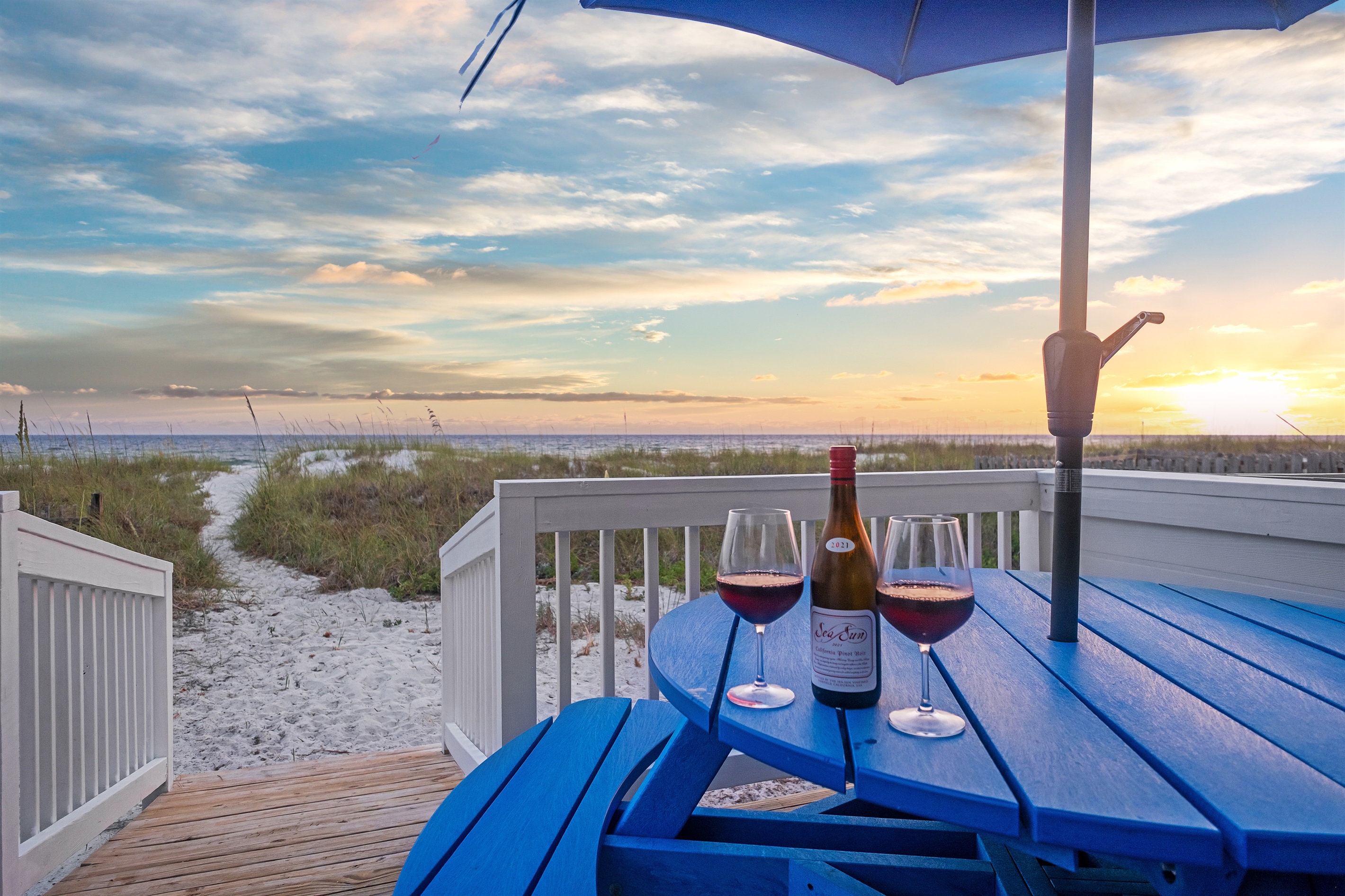 Unwind on the beachfront deck with stunning sunset views. Enjoy your evenings with a glass of wine and the sound of the waves.