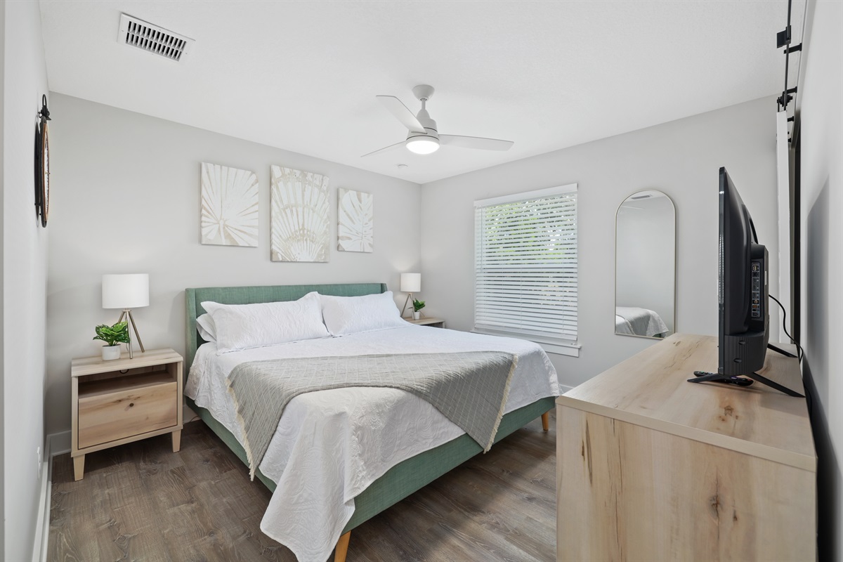 Green king room includes a tv, walk in closet and connecting pocket door to 1st floor bathrom