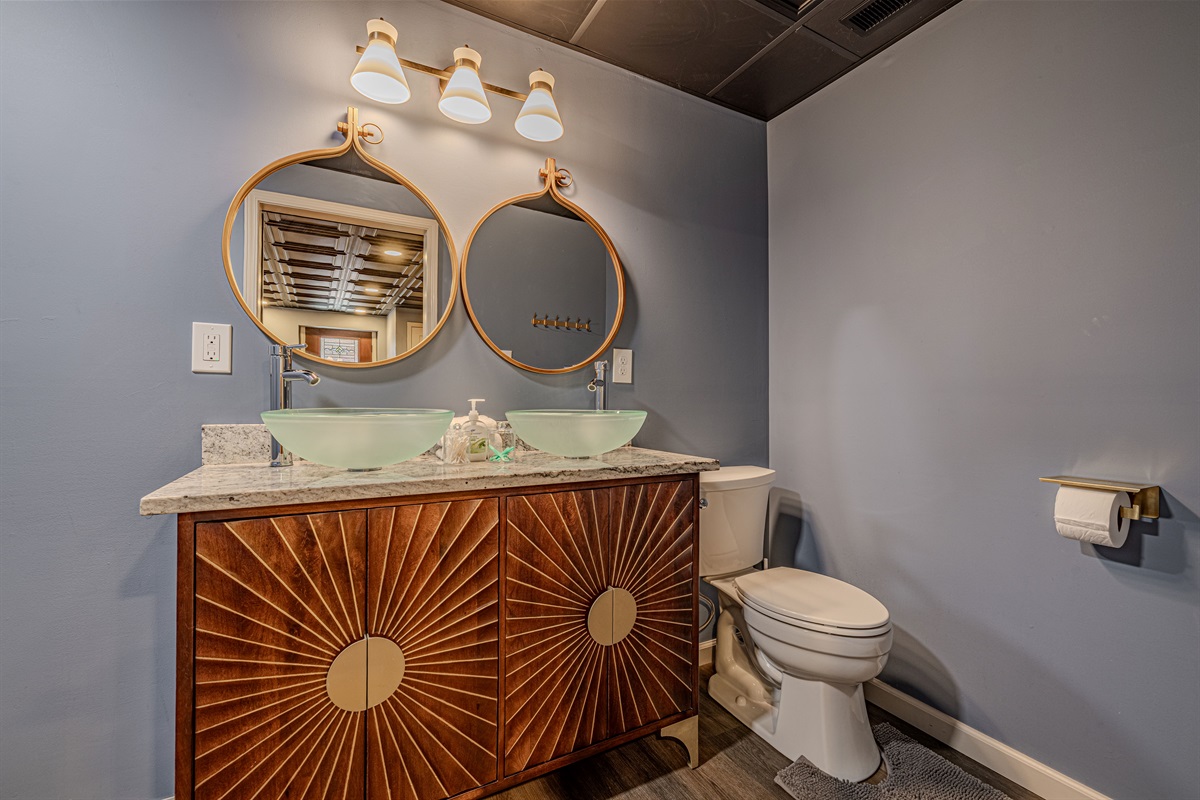 The half bath on the bottom level is great for bunk room residents and game room occupants.