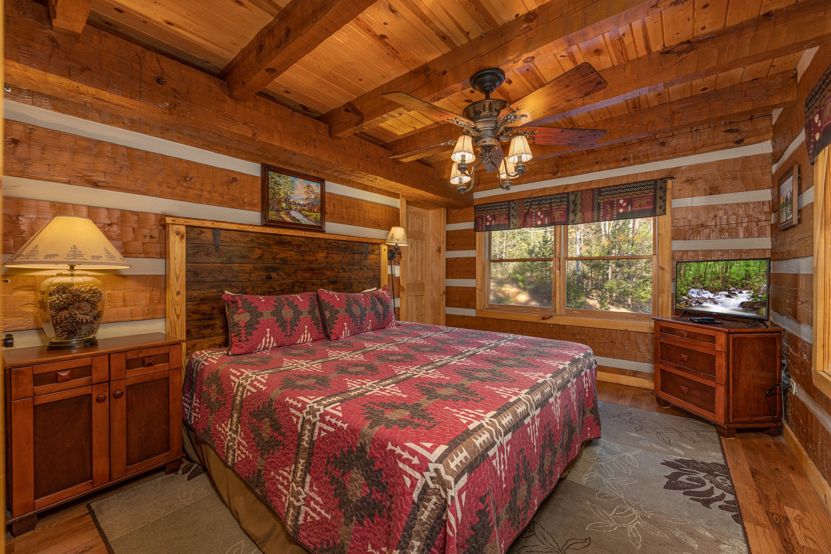 Main floor king bedroom - sleep comfortably in a quiet, private setting -  king bed and space to truly relax. Connects to the bathroom; smart TV