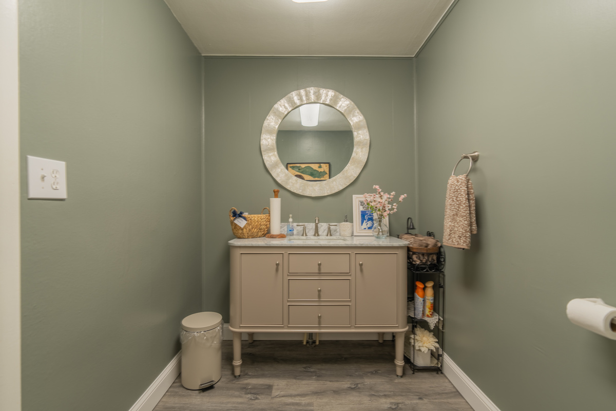 Charming Victorian-inspired powder room conveniently located on the main level of the inn