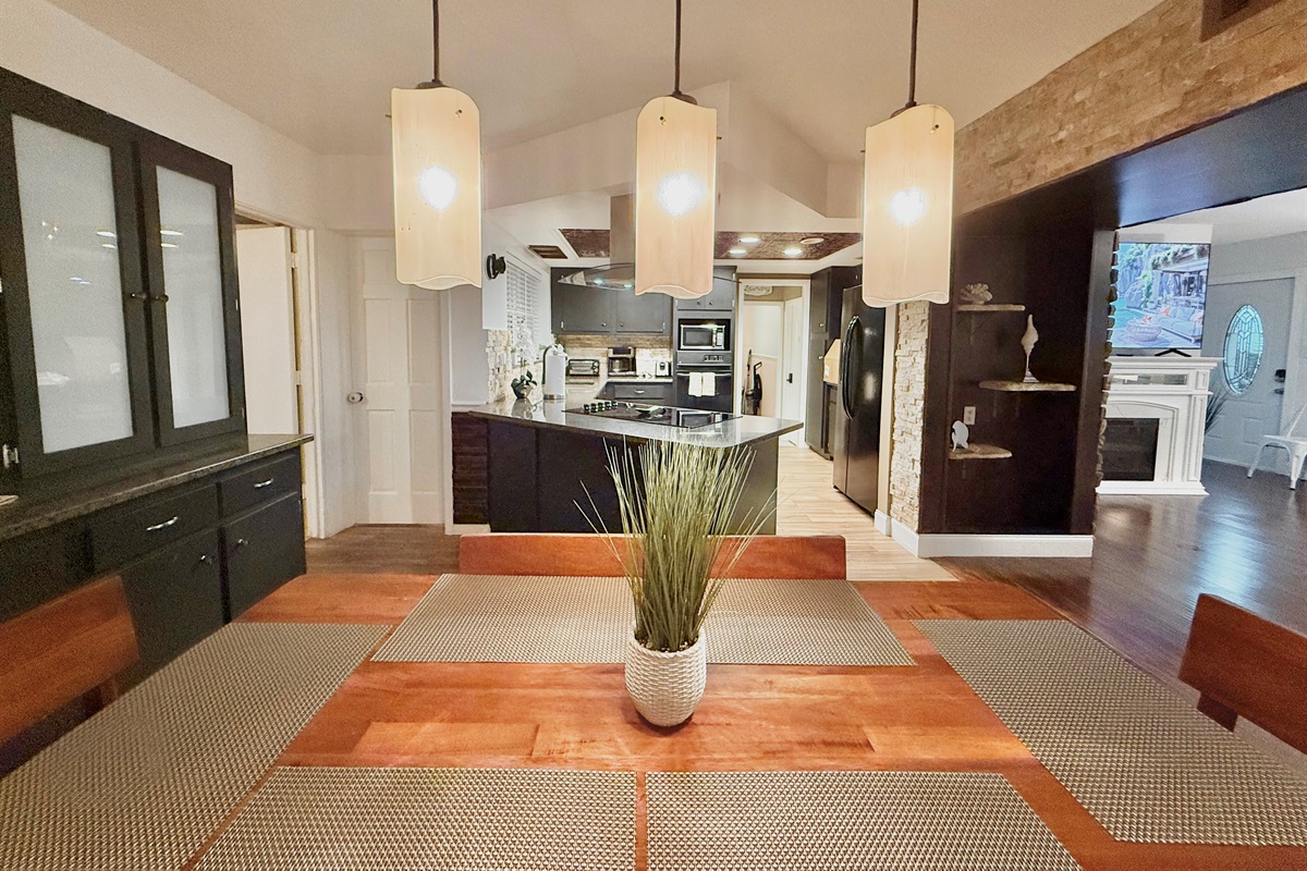 This warm, wood-toned dining space invites you to linger longer—perfect for enjoying coffee in the morning or wine at night.