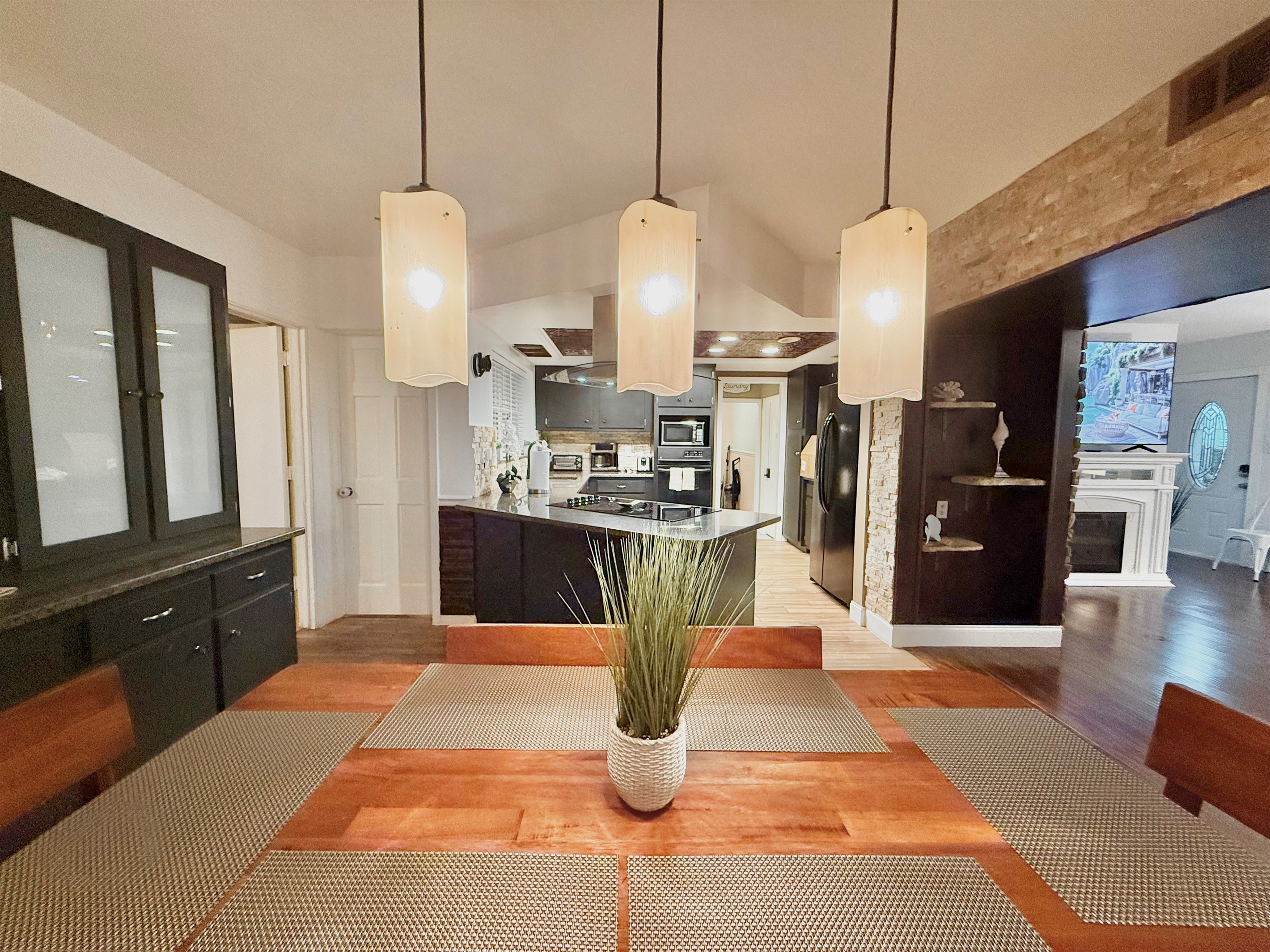This warm, wood-toned dining space invites you to linger longer—perfect for enjoying coffee in the morning or wine at night.