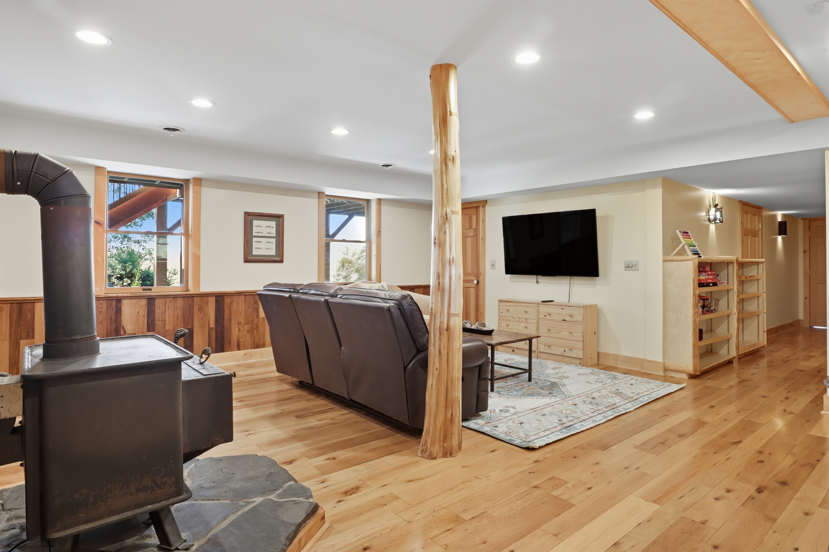 Comfortable living space with TV and lounge seating.