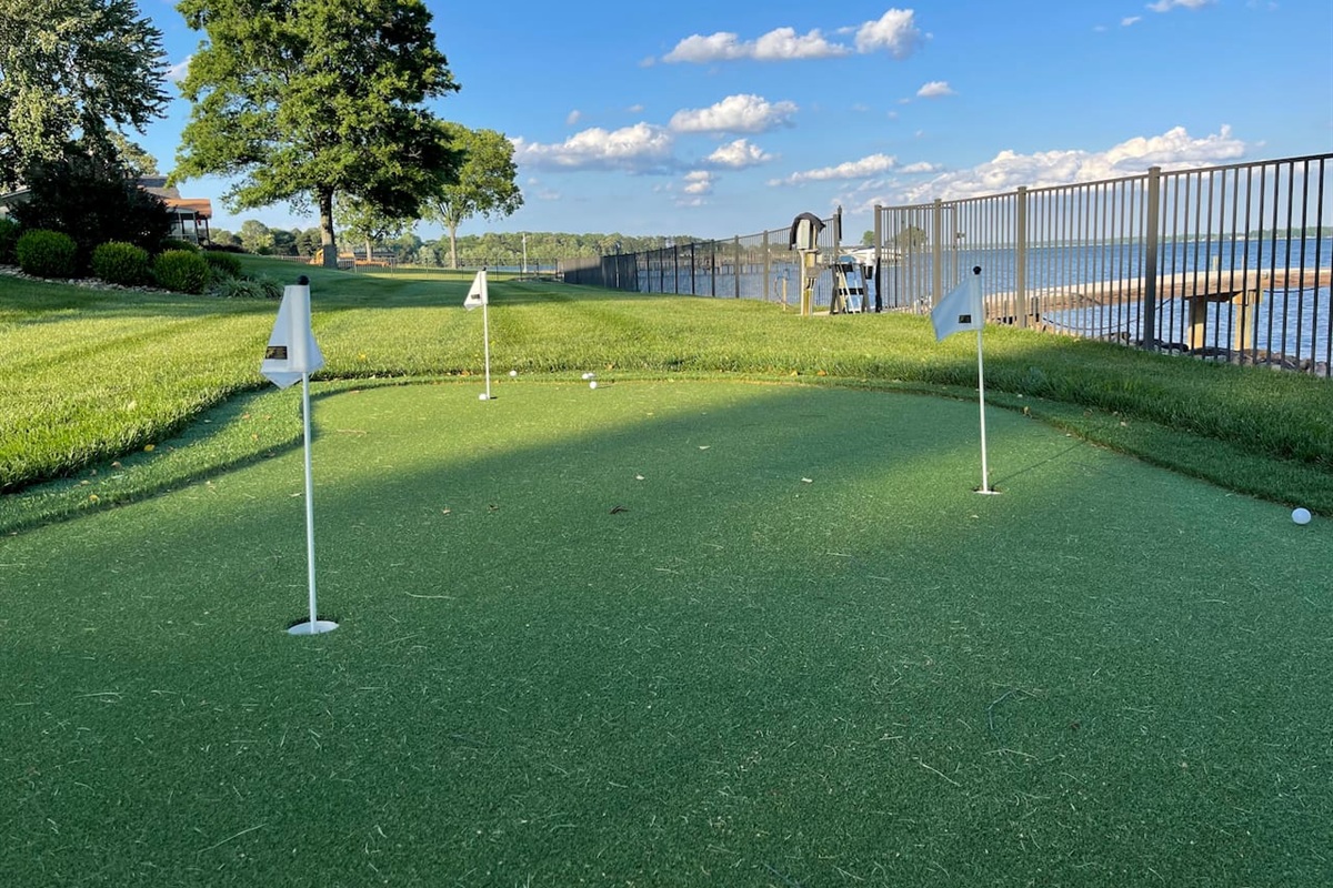 Golf putting green with 3 holes and fringe.
