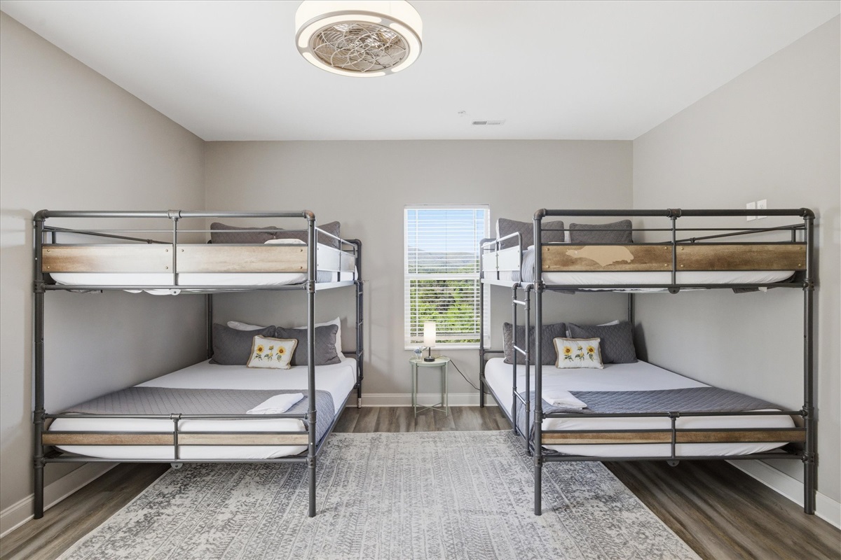 Plenty of room to claim your space here—Unit 4’s bunk setup gives everyone a comfortable spot to land without the usual shuffle.