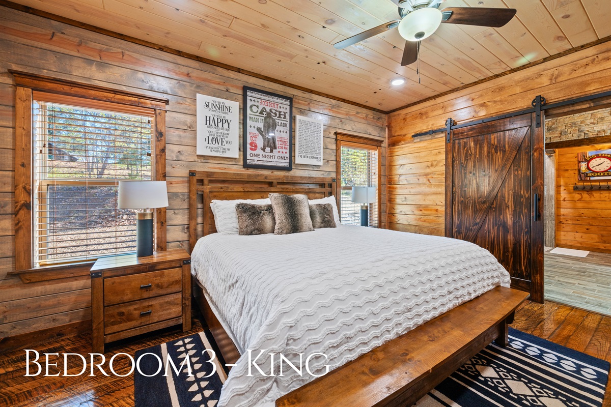 This inviting bedroom blends rustic wood accents with soft, comfortable bedding to create a warm and restful space where you can truly unwind after a full day of activities.