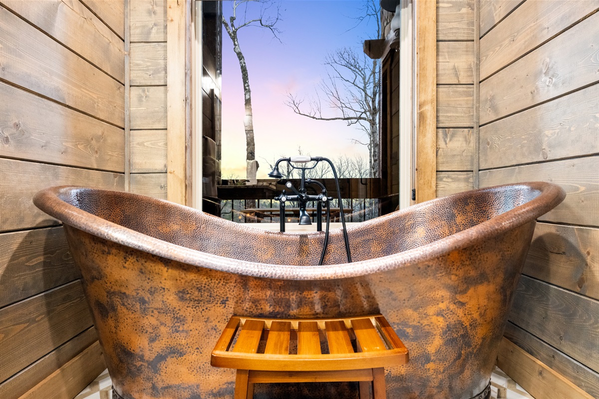 Vintage copper clawfoot tub creating the perfect spa-inspired retreat