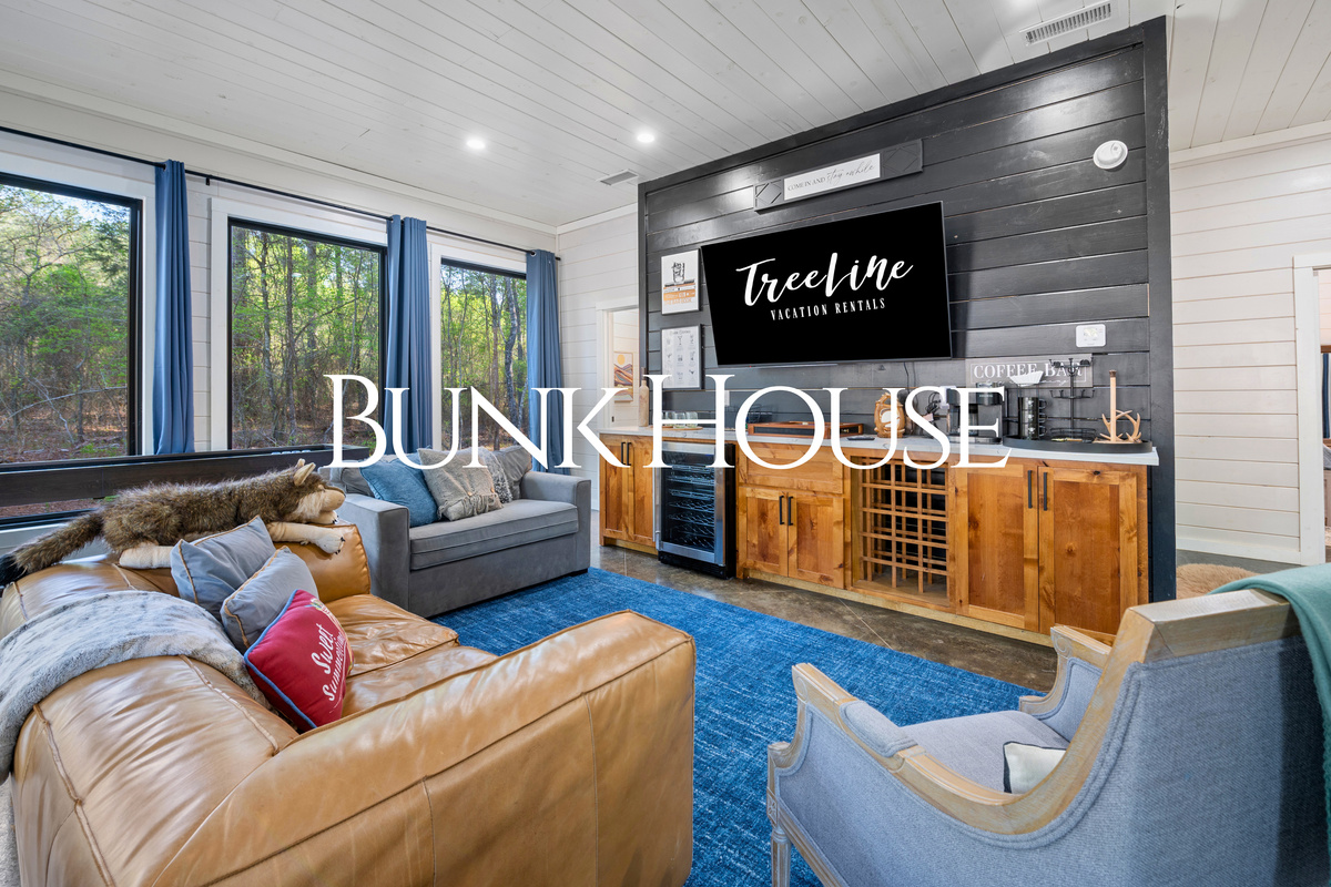 The spacious bunkhouse gives everyone another place to gather, featuring comfortable seating, a wet bar, and plenty of room to relax between adventures.