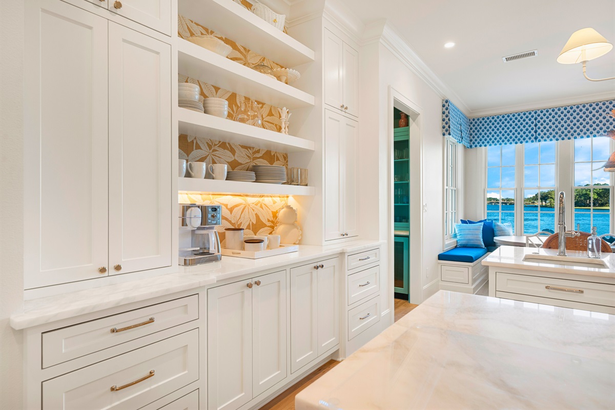 Dining area with coastal-inspired design and elegant lighting.