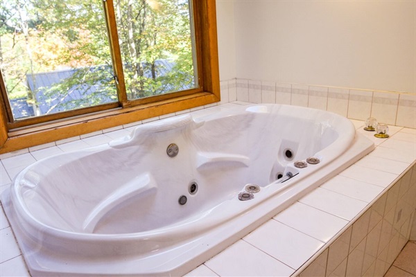 The primary bedroom soaking tub is the perfect spot to close the door and unwind. (jets not operable)