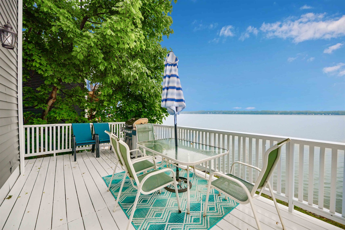 Expansive lakefront deck with stunning views, perfect for morning coffee