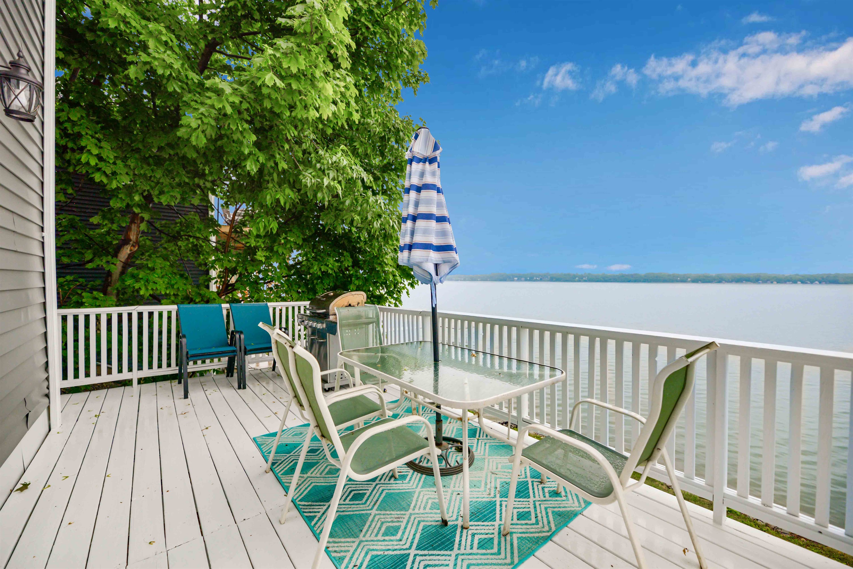 Expansive lakefront deck with stunning views, perfect for morning coffee