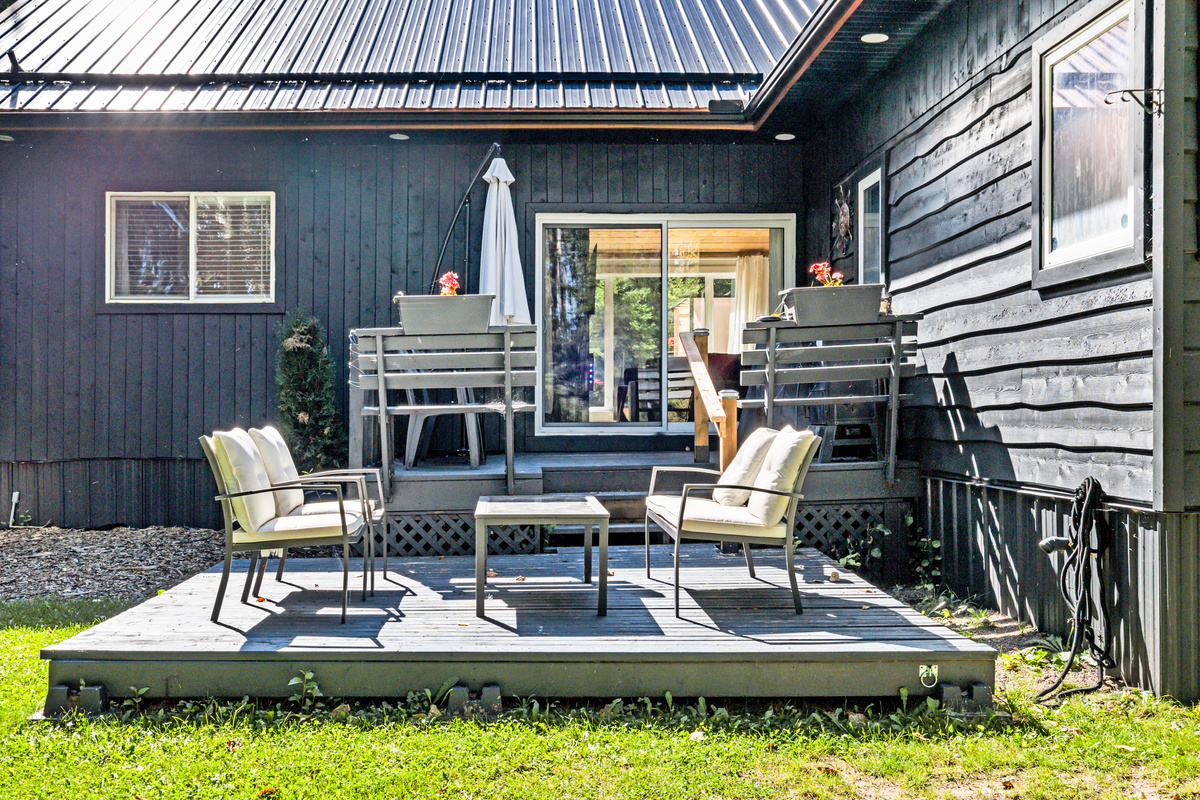 Step out back to an additional outdoor seating area—an easy place to enjoy sunshine, conversation, or a quiet break outside.