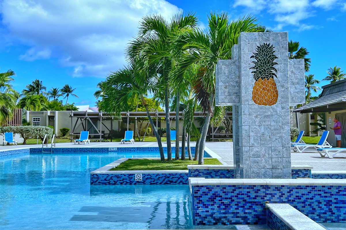 Enjoy a lazy afternoon by the pool, just steps from your condo.