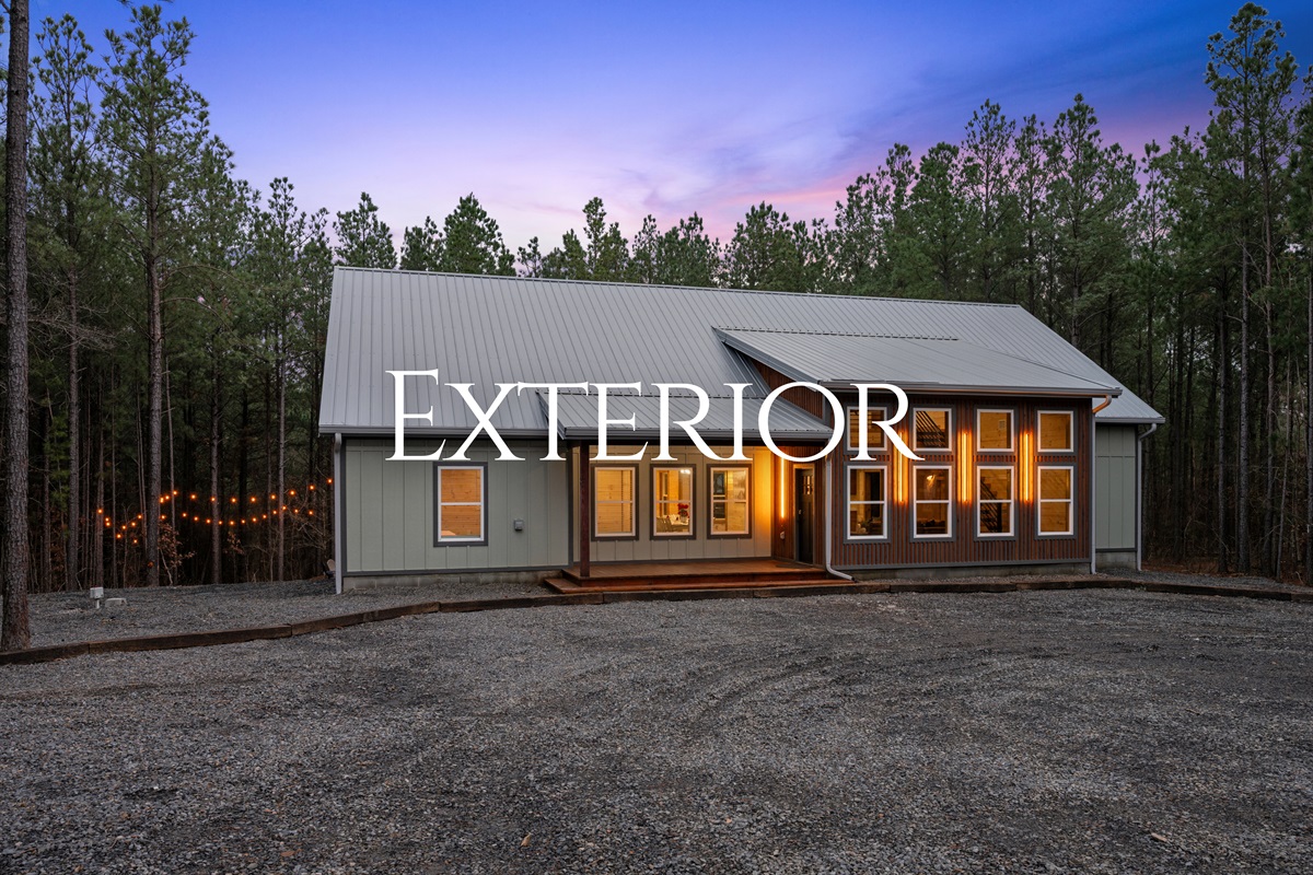 The front exterior of the cabin welcomes guests with warm lighting and classic cabin charm, offering a beautiful first impression as you arrive.