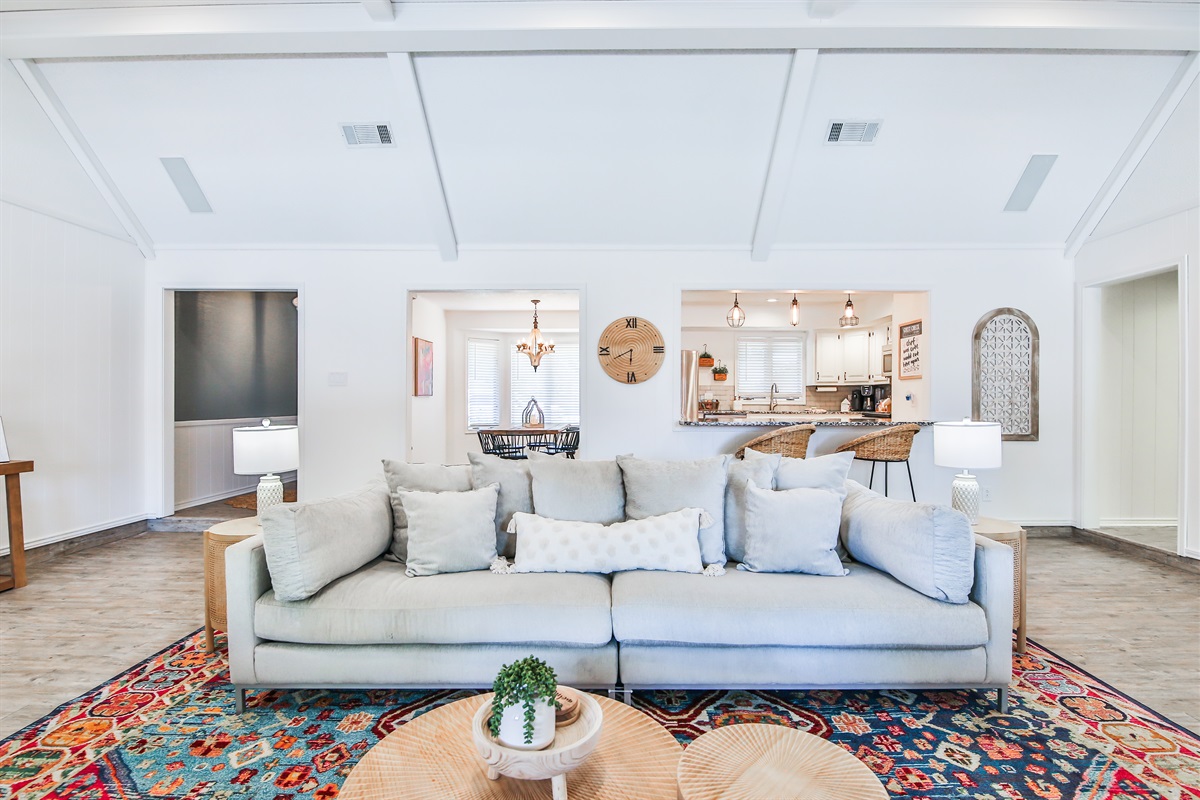 Living room with kitchen in the background 