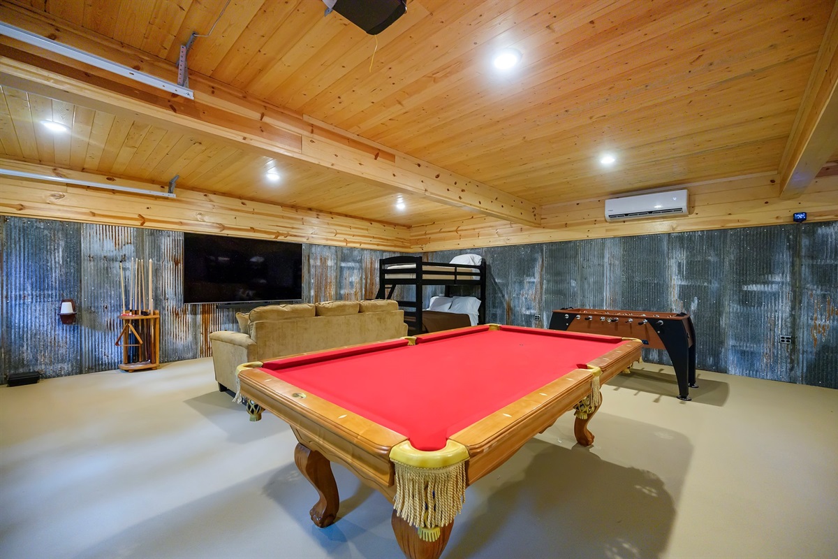 Full game/bunk room with pool, foosball, and ping pong.