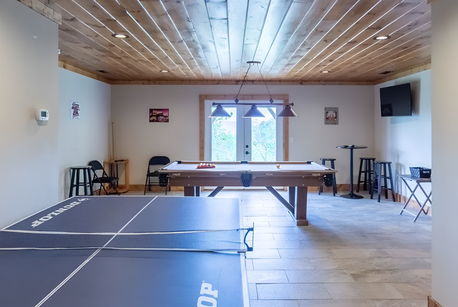 You'll never be bored in our lower level game room, which is complete with a ping pong table, pool table and TV.