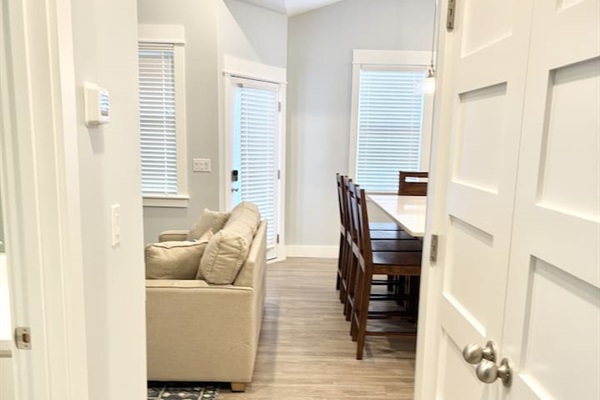 Hallway view connecting living and dining areas