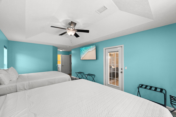 Seamless indoor-outdoor living. This view of the master suite highlights the direct door access straight to the pool area—perfect for a quick dip—along with easy access to your private attached master bathroom.