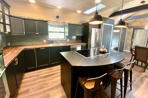 Newly renovated kitchen complete with 36" induction cooktop and wall oven.  Seating for 3 while you cook your meals!