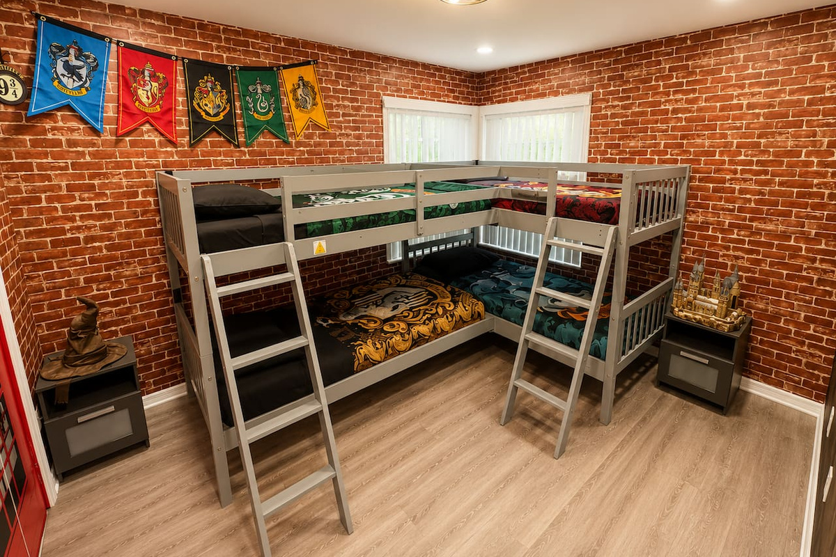 Playful themed bedroom with four twin beds, perfect for sharing!