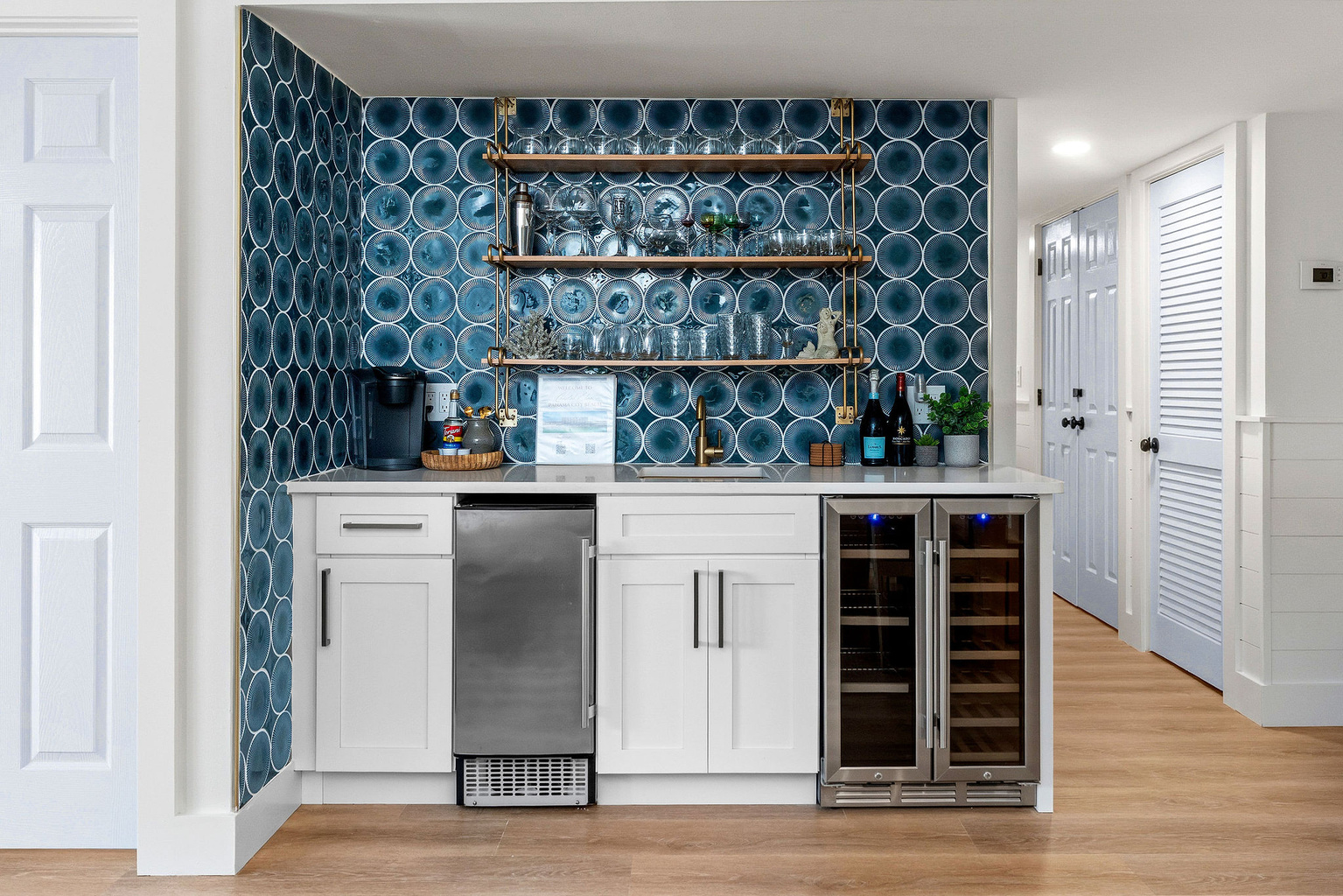 Your entire wet bar awaits! Wine glasses are clean and ready in the upper bistro shelving for a quiet drink at the patio tale after the sun goes down.