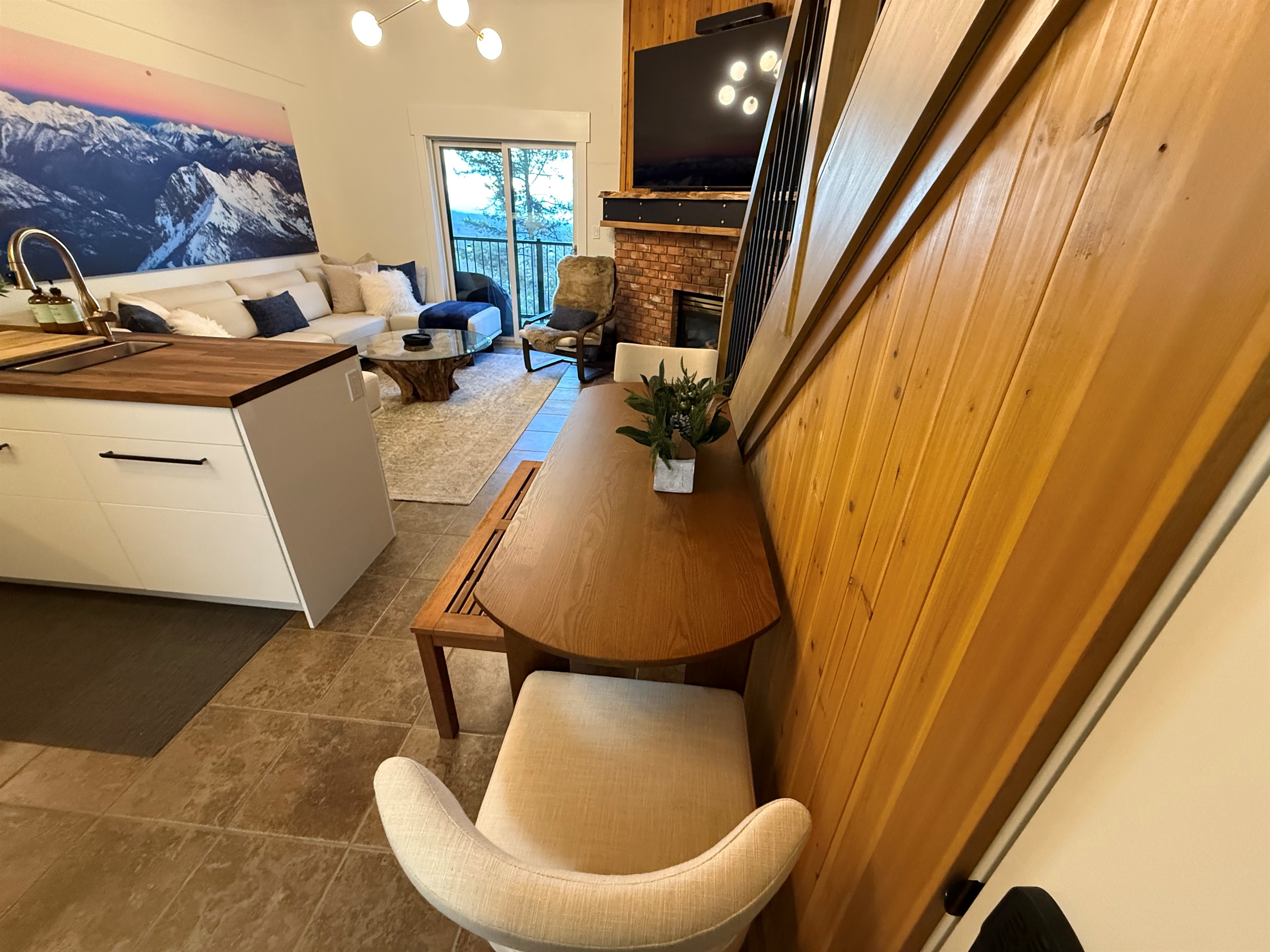 Open-Concept Dining Area: Enjoy meals in the open-concept dining room, which flows seamlessly into the kitchen and living area, providing seating for four with the option to expand.