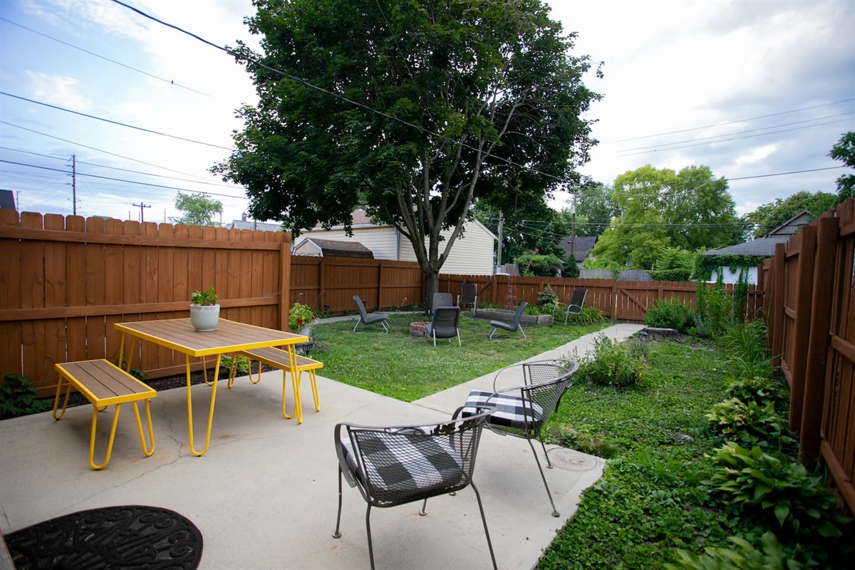 Dedicated garden patio with outdoor dining, lounge seating, and a fully fenced yard — ideal for meals outside, fresh air breaks, and relaxed long-stay living.
