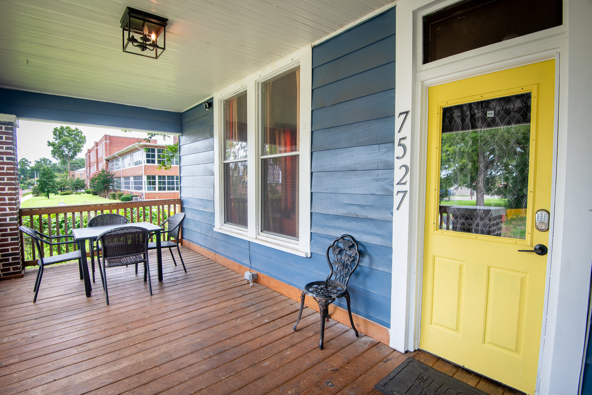 Your stay begins here! Step onto the welcoming front porch, unlock the smart lock on the bright yellow door, and make yourself at home. It's the perfect spot to sip your morning coffee or unwind after a day out.