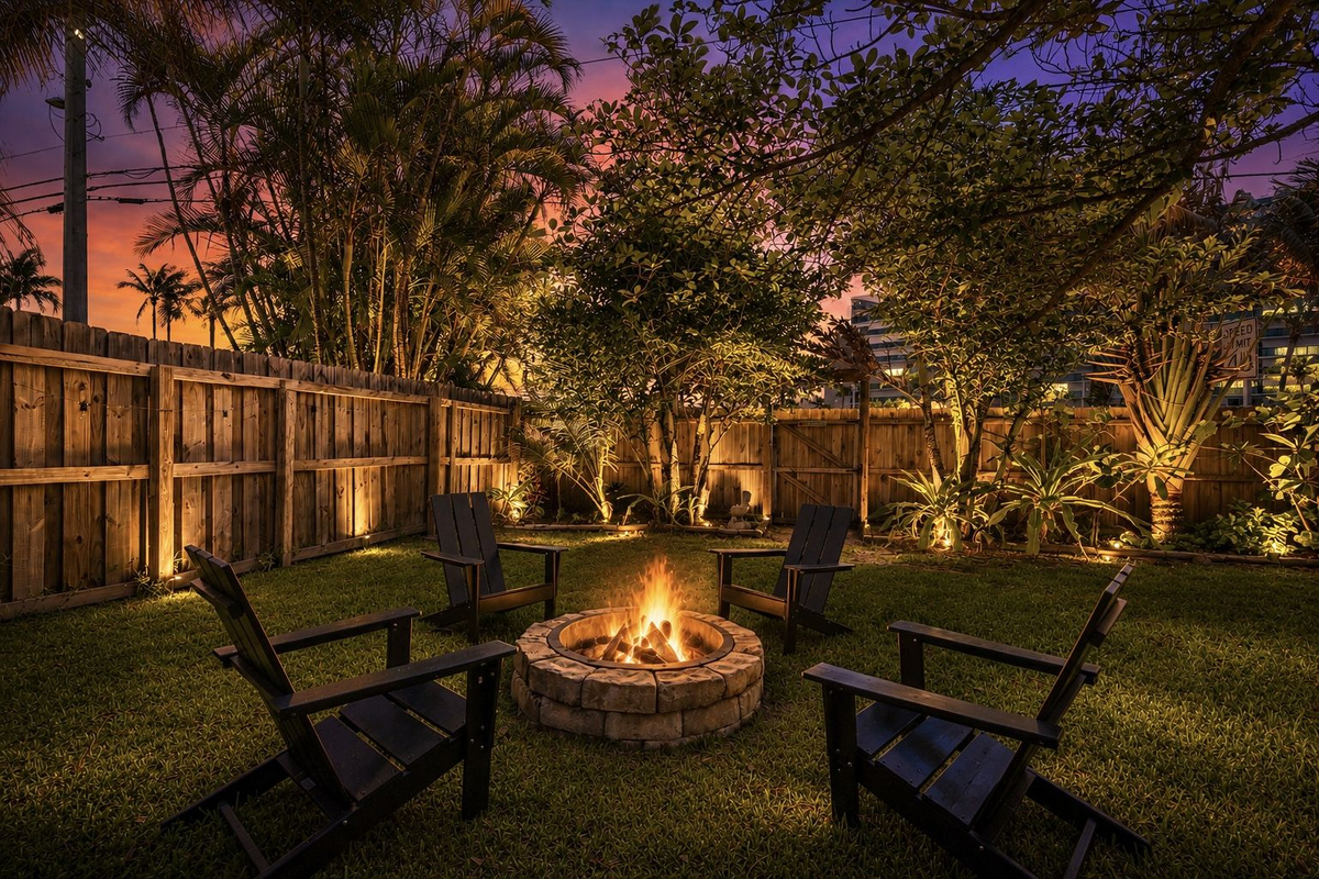 Private fenced outdoor space with fire pit