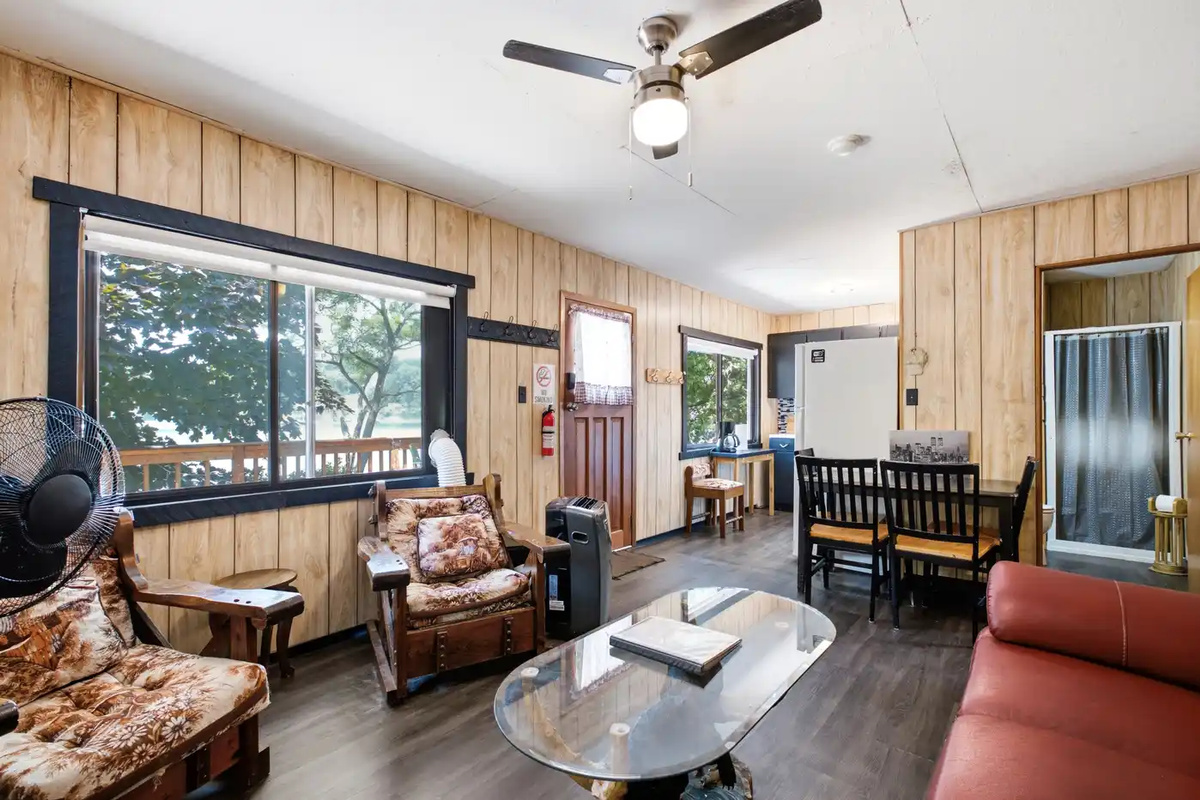 Bright living area with large windows and comfortable seating