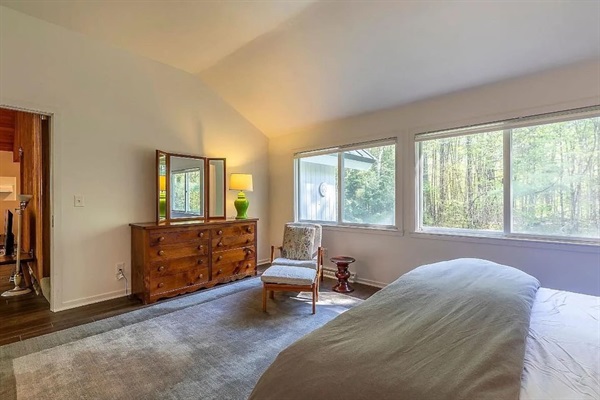 Primary Bedroom: Sunlit views, modern decor, and tranquility await you in this serene haven!