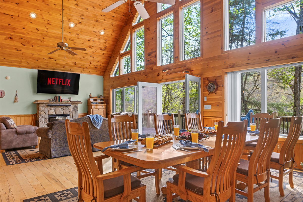 Dining Area and Living Room: Sunlit space with stunning views, perfect for gatherings and movie nights!