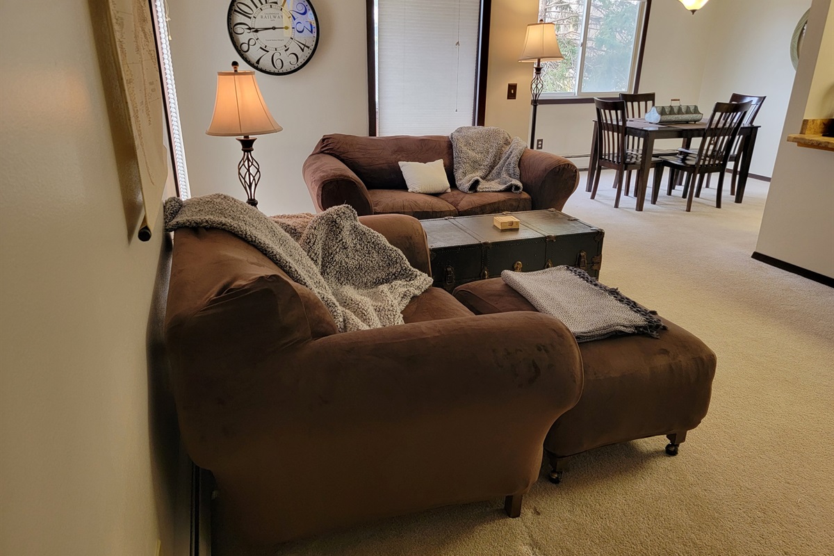 KP101APT5 - Living Room w/love seats, patio access, decorative fireplace, and Roku TV