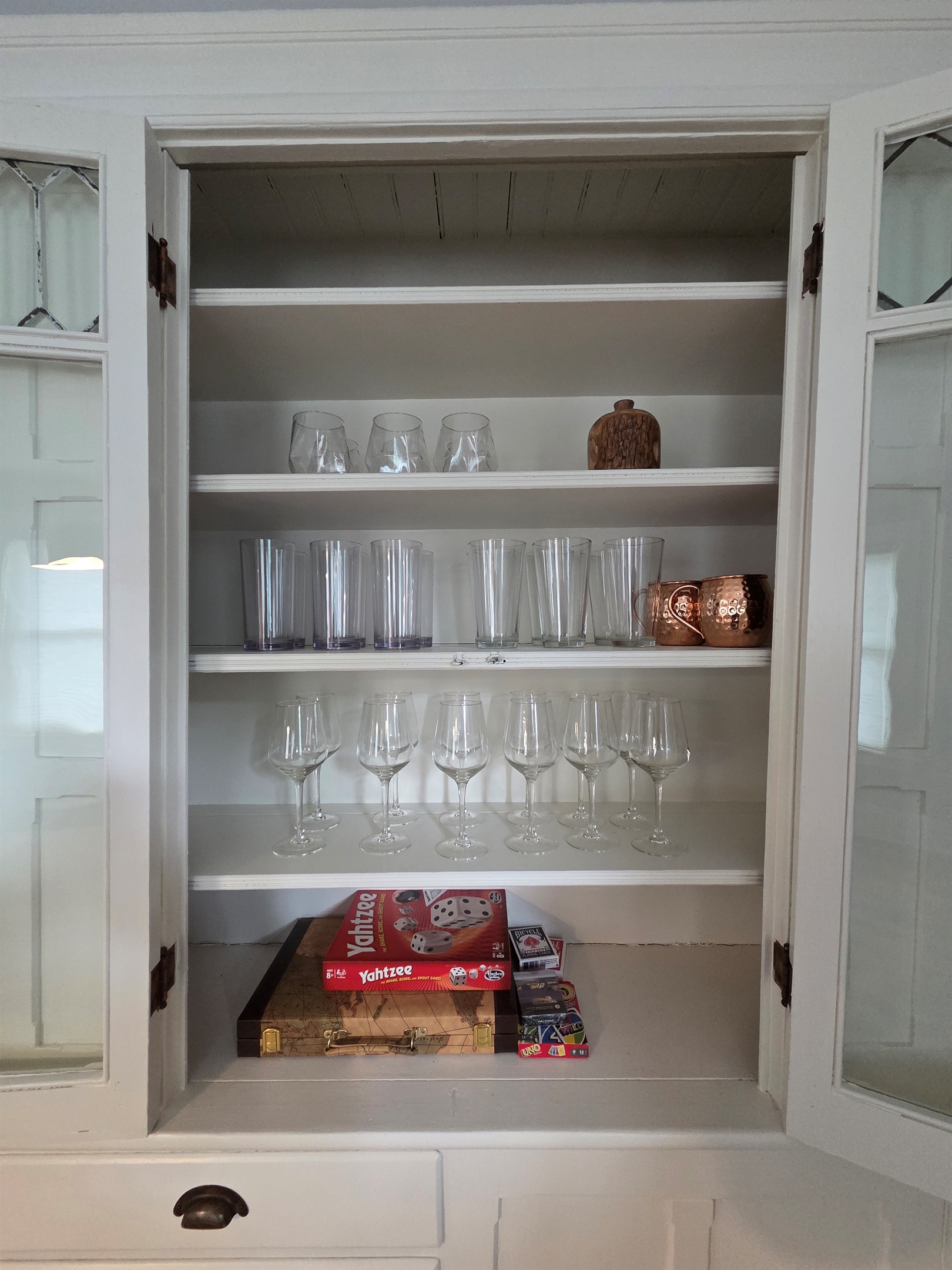 Games and Adult Beverage Glasses in Original Dining Room Built In