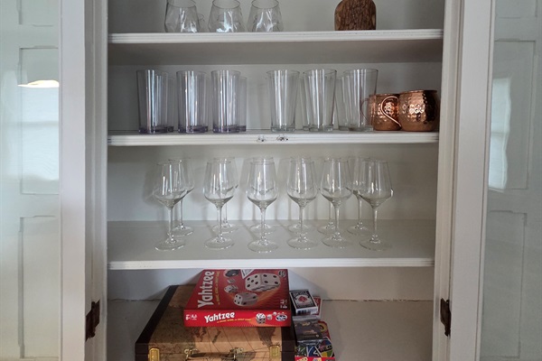 Games and Adult Beverage Glasses in Original Dining Room Built In